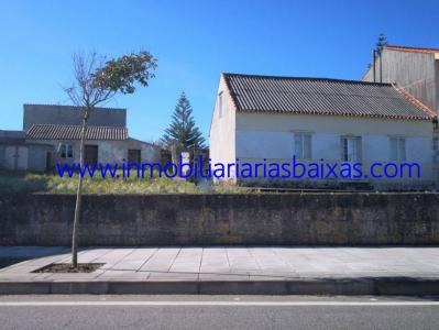 CASA CON TERRENO EN AGUIÑO